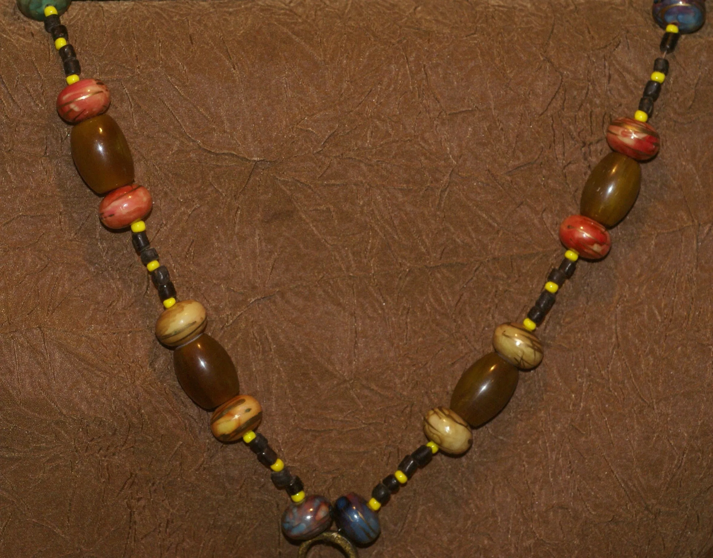 Borneo Tribal Oran Ulu, Dayak, Iban Tribe Heavy Brass Earring Talisman, Ear Weight Now Used as a Pendant for a Necklace with Large Amber Beads & Old Glass Trade Beads NB20