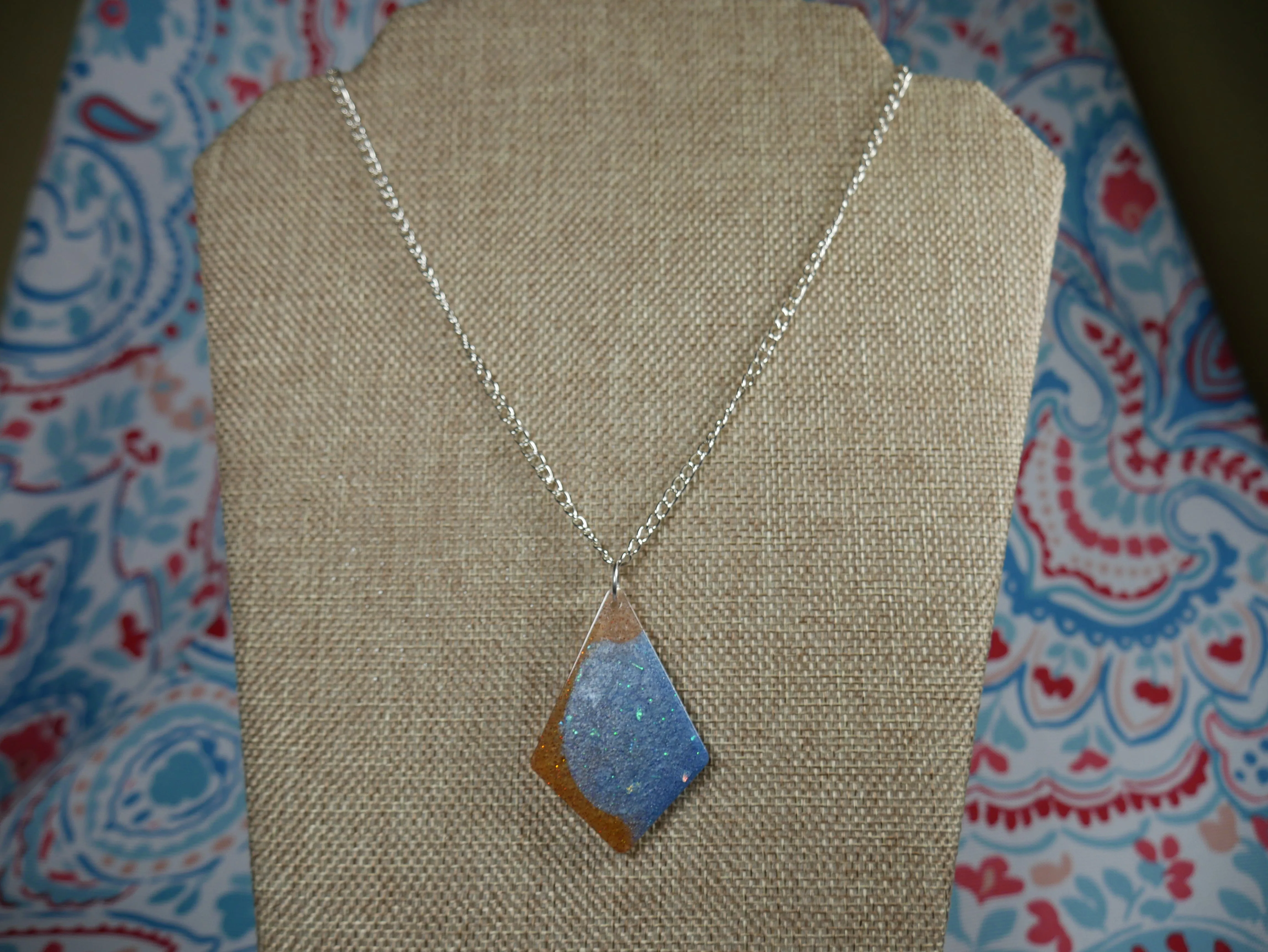 Resin Blue, Silver and Amber Colored Pendant Necklace