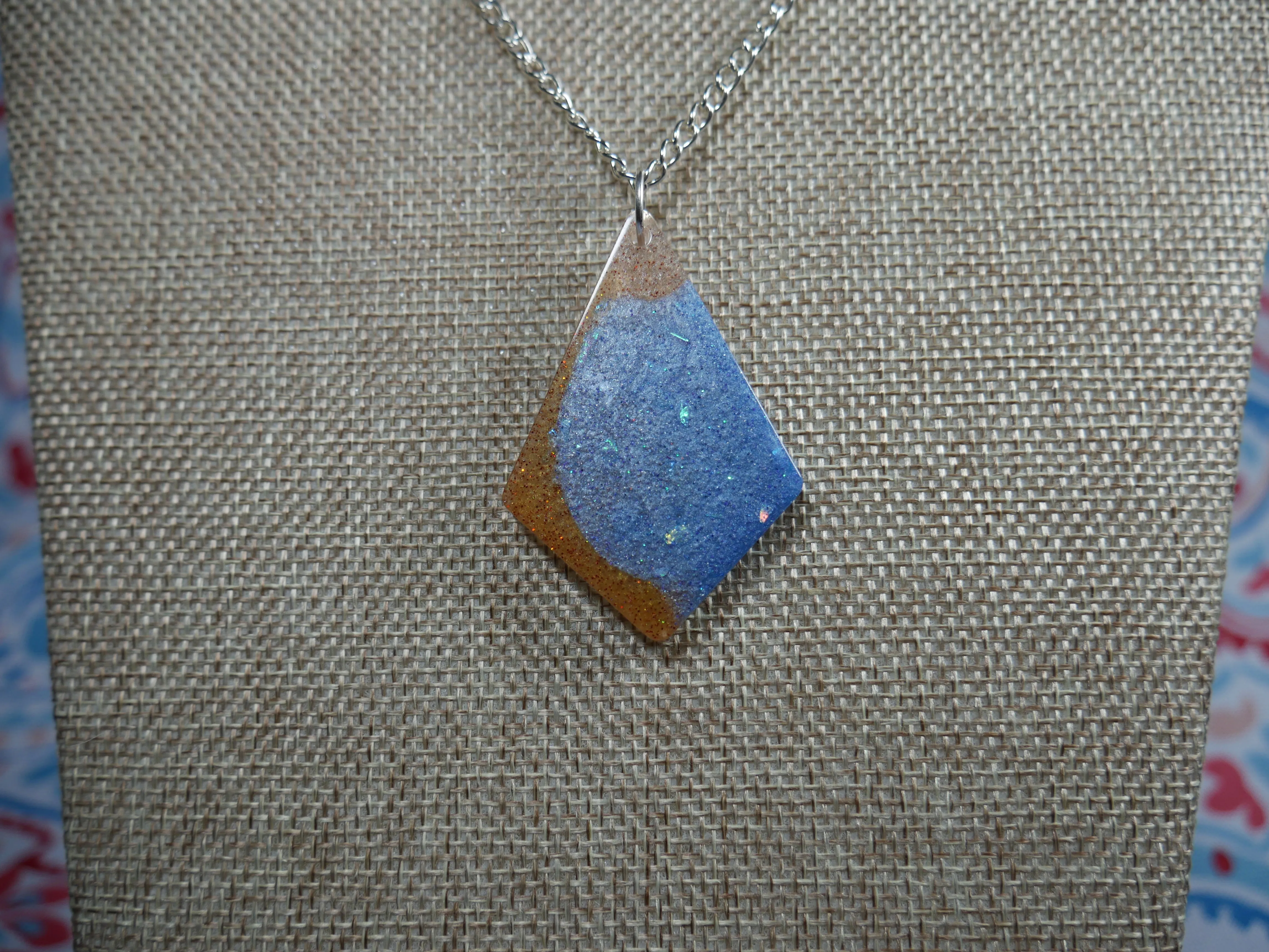 Resin Blue, Silver and Amber Colored Pendant Necklace