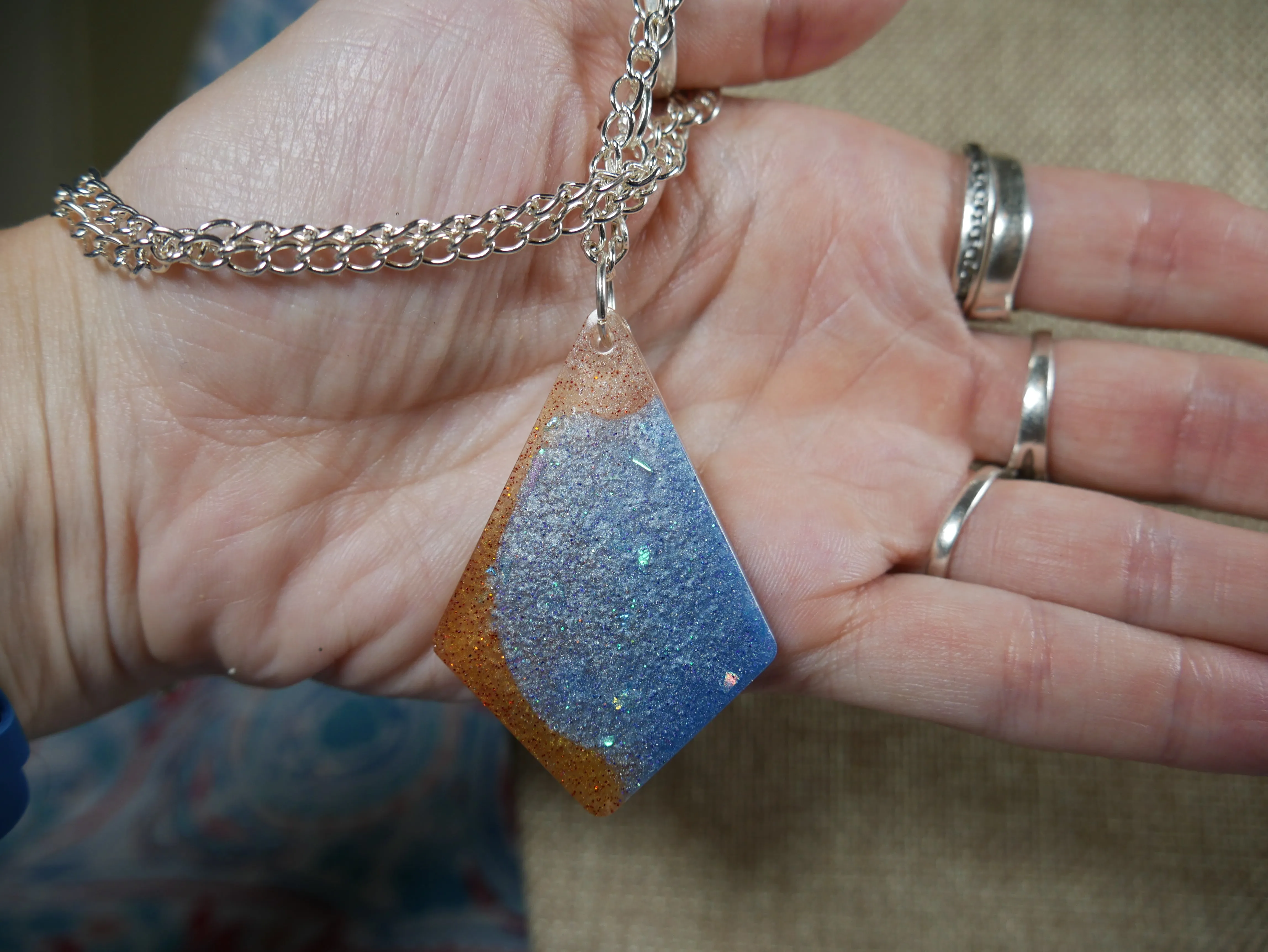 Resin Blue, Silver and Amber Colored Pendant Necklace