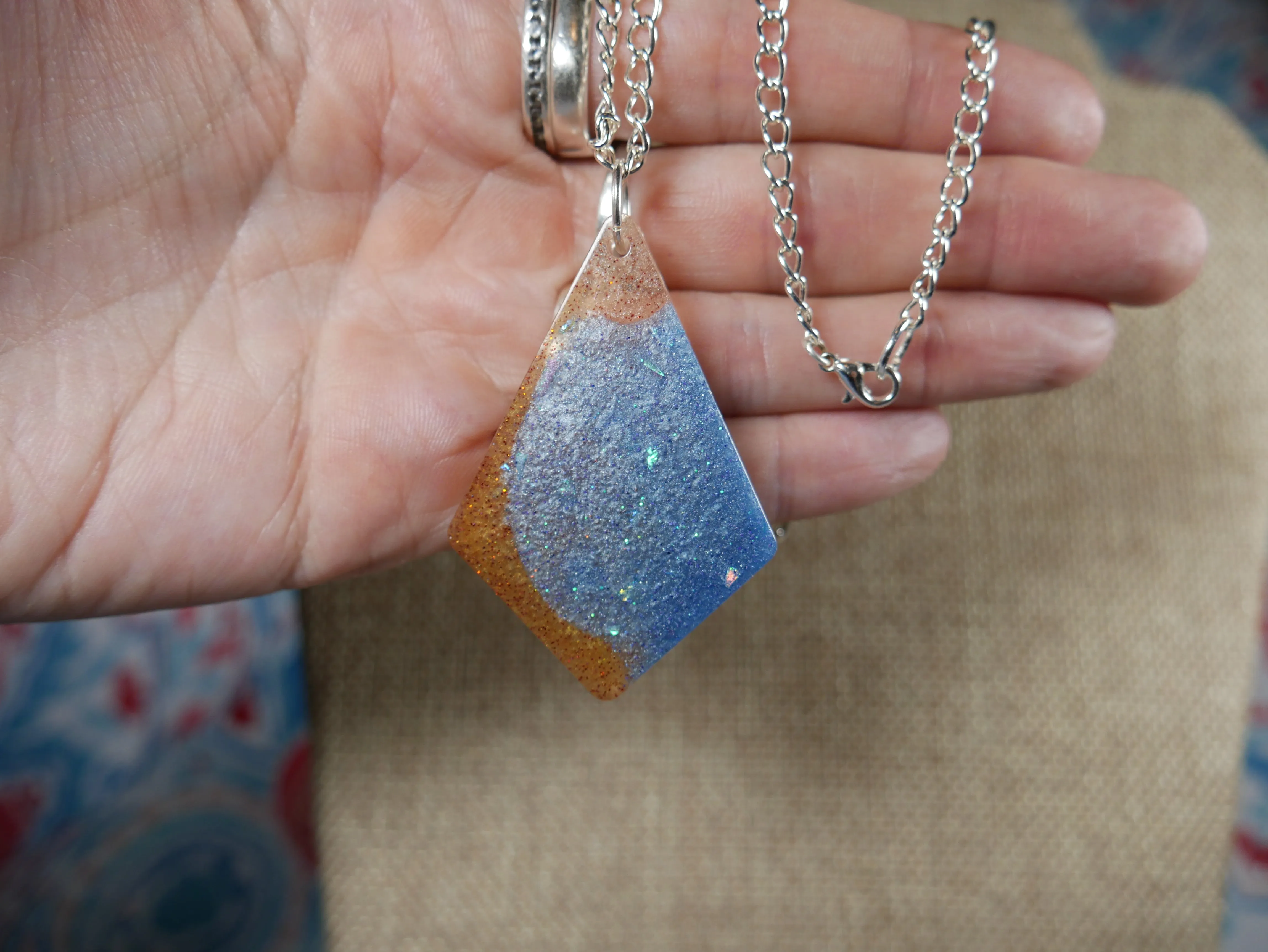 Resin Blue, Silver and Amber Colored Pendant Necklace